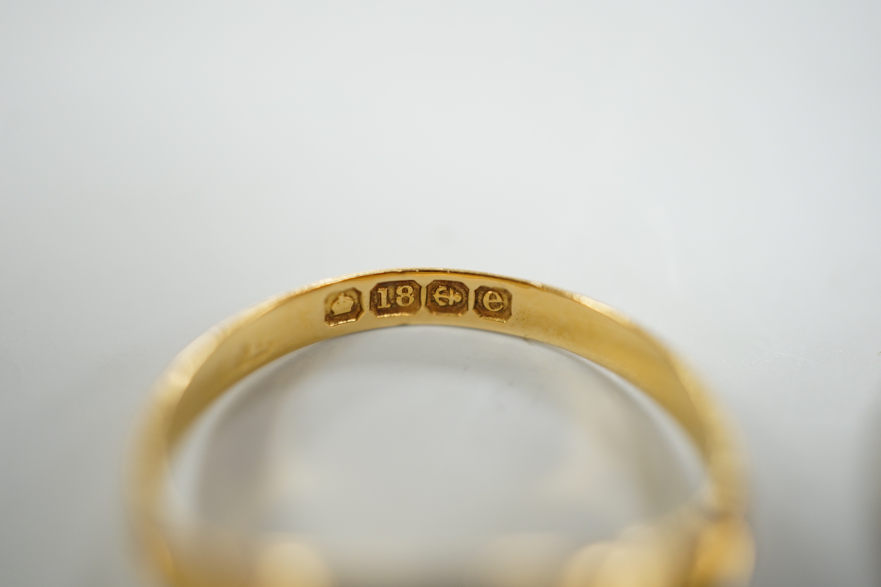 An Edwardian 18ct gold and diamond chip set ring, size M, gross weight 2.6 grams and two later 9ct gold and gem set rings, gross weight 5.5 grams.